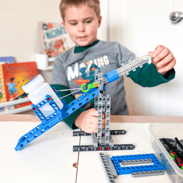 Homeschool learning box featuring a Ferris wheel model and hydraulic robotic arm