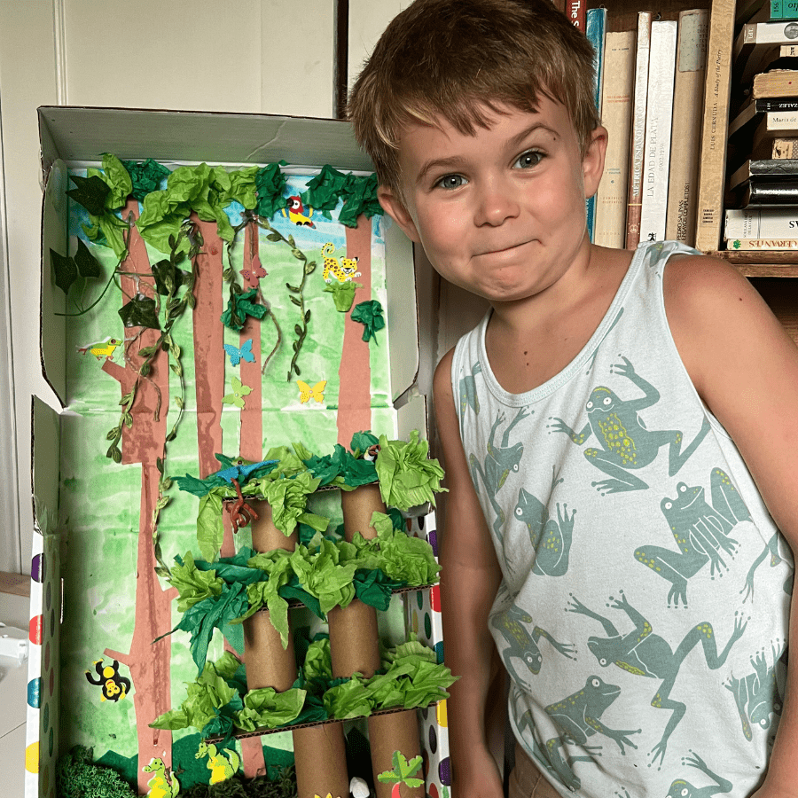 Kids building a rainforest diorama with the Rainforest Homeschool Unit