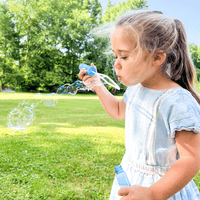 Preschooler creating a rainbow volcano experiment with STEM weather kit