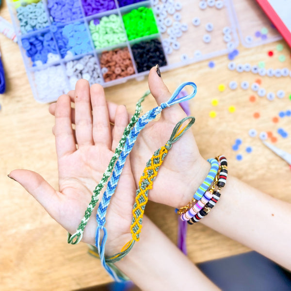 Friendship bracelet-making kit with colorful beads and string